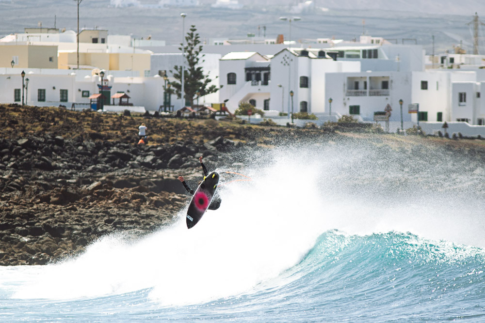 Lanzarote is a perfect playground for airs with strong winds allowing for maximum and protection. Here, Seb throws a big rotator into the flat.